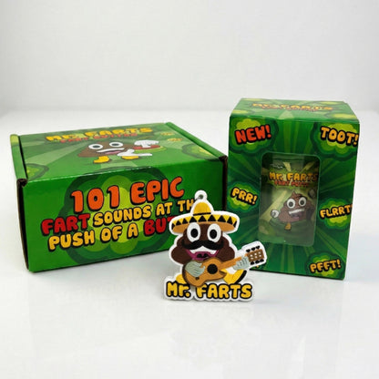 A novelty product set featuring a cartoon poop character called Mr Farts. in his Taco Farts outfit playing guitar with the text 'Mr. Farts' on a small keyring, shown alongside a Fart Button and Fart Putty on green packaging boxes on a white background.