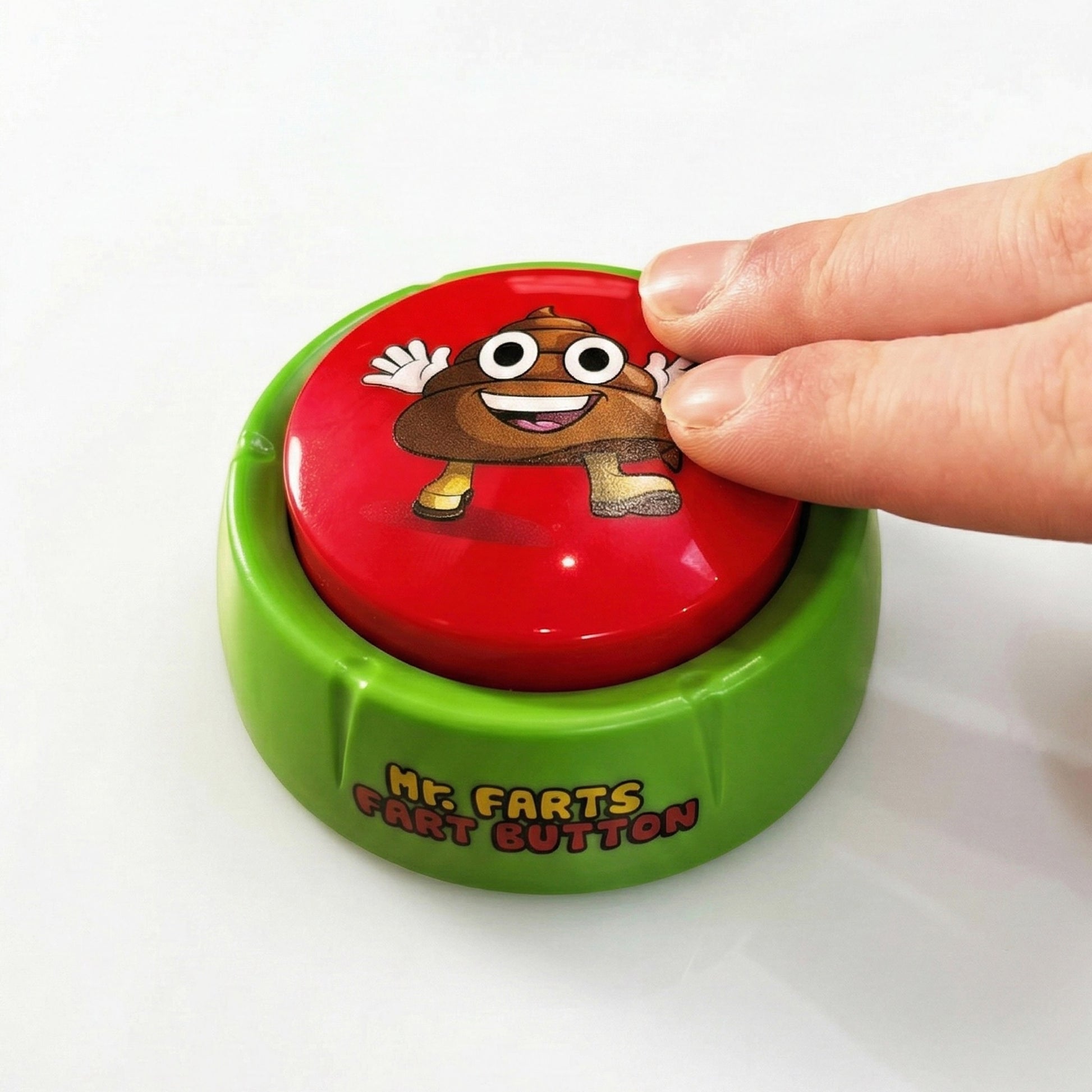 mr farts fart button with big red button, being pressed down by 2 fingers on a white background. Button reads 'Mr Farts Fart Button'