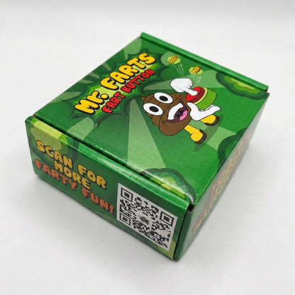 A green cardboard product box for 'Mr Farts Fart Button' featuring a cartoon poop (Mr Farts) character and a QR code on the side, photographed on a white background.